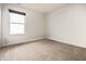 A carpeted bedroom illuminated by a window with blinds, ready for personalization at 1221 Danielle Rd, Lebanon, IN 46052