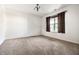 Cozy bedroom with neutral carpet, a window with brown curtains, and fresh paint at 1221 Danielle Rd, Lebanon, IN 46052