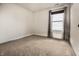 A carpeted bedroom illuminated by a window with curtains, ready for personalization at 1221 Danielle Rd, Lebanon, IN 46052