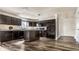 Spacious kitchen with dark cabinets, stainless steel appliances, and hardwood floors at 1221 Danielle Rd, Lebanon, IN 46052