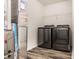 A convenient laundry room with modern black front-loading washer and dryer at 1221 Danielle Rd, Lebanon, IN 46052