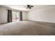 Open living room featuring neutral walls, carpet, and sliding glass doors at 1221 Danielle Rd, Lebanon, IN 46052