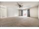 Bright living room with sliding glass door and neutral carpet at 1221 Danielle Rd, Lebanon, IN 46052