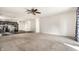 Spacious living area, connecting to kitchen, with carpet and sliding glass door at 1221 Danielle Rd, Lebanon, IN 46052