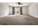Bright and spacious living room with ceiling fan and sliding glass doors at 1221 Danielle Rd, Lebanon, IN 46052
