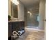 Modern bathroom with a sleek vanity, a glass-enclosed shower, and neutral tones throughout at 1303 N 8Th St, Elwood, IN 46036