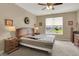 Comfortable bedroom with a ceiling fan, neutral carpet and lots of natural light at 1401 Blackthorne N Trl, Plainfield, IN 46168