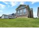 Beautiful home exterior with brick facade, well-maintained lawn, and a backyard deck at 1401 Blackthorne N Trl, Plainfield, IN 46168