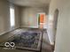 Spacious living room featuring neutral-toned walls, carpeted floor, and natural light at 1440 E Morgan E St, Martinsville, IN 46151