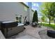 Outdoor patio with hot tub and outdoor seating on a well-manicured lawn at 1454 Woodfield Dr, Greenwood, IN 46143