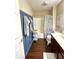 Well-lit bathroom with blue paneled accent wall, tub, shower, and decorative towels at 1454 Woodfield Dr, Greenwood, IN 46143