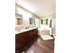 Bathroom with double vanity, soaking tub, and separate shower, creating a spa-like retreat at 1454 Woodfield Dr, Greenwood, IN 46143