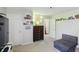 Bright bedroom has a pull-out couch and charming wall decorations at 1454 Woodfield Dr, Greenwood, IN 46143