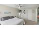 Bedroom featuring carpeted floors, a ceiling fan, and a window at 1454 Woodfield Dr, Greenwood, IN 46143