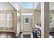 Bright foyer featuring hardwood floors, high ceilings, and a decorative front door with sidelights at 1454 Woodfield Dr, Greenwood, IN 46143