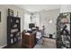 Comfortable home office provides a dedicated workspace with natural light and ample shelving at 1454 Woodfield Dr, Greenwood, IN 46143