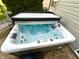 Relaxing backyard hot tub with crystal clear bubbling water at 1454 Woodfield Dr, Greenwood, IN 46143