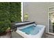 Hot tub with open lid, perfect for soaking and relaxing in a private backyard at 1454 Woodfield Dr, Greenwood, IN 46143