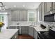 Bright kitchen area showcasing a tiled backsplash, stainless steel appliances, and modern countertops at 1454 Woodfield Dr, Greenwood, IN 46143