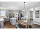 Updated kitchen featuring gray cabinets, stainless steel appliances, and an island with a white countertop at 1454 Woodfield Dr, Greenwood, IN 46143