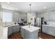 Modern kitchen featuring gray cabinetry, stainless steel appliances, and a center island with seating at 1454 Woodfield Dr, Greenwood, IN 46143