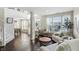 Inviting living room with hardwood floors, large windows, and an open layout to the dining area at 1454 Woodfield Dr, Greenwood, IN 46143