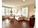 Inviting living room featuring hardwood floors, comfortable seating, large windows, and modern decor for a cozy atmosphere at 1454 Woodfield Dr, Greenwood, IN 46143