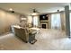 Comfortable living room with a cozy fireplace, neutral decor, and large windows offering plenty of natural light at 1454 Woodfield Dr, Greenwood, IN 46143