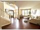 Bright, spacious living room with high ceilings, hardwood floors, and large windows offering plenty of natural light at 1454 Woodfield Dr, Greenwood, IN 46143