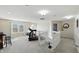 Loft space featuring fitness equipment, carpeted floors, and natural light from a large window at 1454 Woodfield Dr, Greenwood, IN 46143
