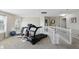 Bright loft area is equipped with fitness equipment and ample space for various activities at 1454 Woodfield Dr, Greenwood, IN 46143