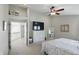Angle shot of the main bedroom featuring a ceiling fan, carpeted floors, and a large dresser at 1454 Woodfield Dr, Greenwood, IN 46143