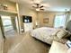 Bright and airy bedroom featuring a lofted ceiling, large bed, and neutral decor at 1454 Woodfield Dr, Greenwood, IN 46143