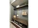 Well-organized mudroom with a bench, shelving, and hooks, providing a convenient space for storage and organization at 1454 Woodfield Dr, Greenwood, IN 46143