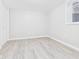 Spacious basement featuring light gray flooring, a window, and a white closet door at 1505 E 30Th St, Anderson, IN 46016