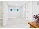 Bright basement area with white walls, modern floors, and decorative plants at 1505 E 30Th St, Anderson, IN 46016