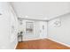 Bright living room with hardwood floors, white walls, and natural light from the windows at 1505 E 30Th St, Anderson, IN 46016