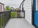 Charming porch with black railing and a view of the neighborhood at 1505 E 30Th St, Anderson, IN 46016