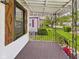 Inviting covered porch with stylish shutters and wrought iron railing at 1505 E 30Th St, Anderson, IN 46016
