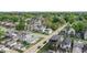 An aerial view shows a vibrant neighborhood with diverse architecture and mature trees lining the streets at 1505 Spann Ave, Indianapolis, IN 46203