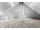 Spacious attic with unique brick chimney and cozy carpet at 1505 Spann Ave, Indianapolis, IN 46203
