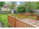 Wooden backyard deck overlooking green lawn and shed at 1505 Spann Ave, Indianapolis, IN 46203