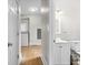 Bathroom with sink and toilet adjacent to laundry room with washer and dryer at 1505 Spann Ave, Indianapolis, IN 46203