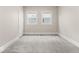 Bright bedroom boasts plush carpet, fresh paint, and sunny windows at 1505 Spann Ave, Indianapolis, IN 46203