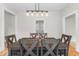 Dining area featuring an elegant light fixture over a wood table with six chairs at 1505 Spann Ave, Indianapolis, IN 46203