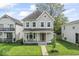 Inviting two-story home with a covered porch, perfect for enjoying the outdoors at 1505 Spann Ave, Indianapolis, IN 46203
