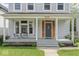 Charming front porch with seating, perfect for enjoying the outdoors and neighborhood views at 1505 Spann Ave, Indianapolis, IN 46203