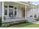 Inviting front porch with seating area, perfect for relaxing and enjoying the neighborhood at 1505 Spann Ave, Indianapolis, IN 46203