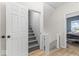 Upstairs hallway with view of gray stairs and bedroom at 1505 Spann Ave, Indianapolis, IN 46203