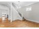 Elegant staircase with modern lighting and hardwood floors throughout the entry at 1505 Spann Ave, Indianapolis, IN 46203